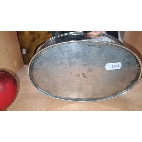 707 - Oval pewter biscuit tin dates 1774 with heart-shaped knob. Engraved 