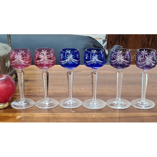 716 - Set of six cut crystal stemware glasses in rich pink and blue hues, featuring intricate starburst pa... 