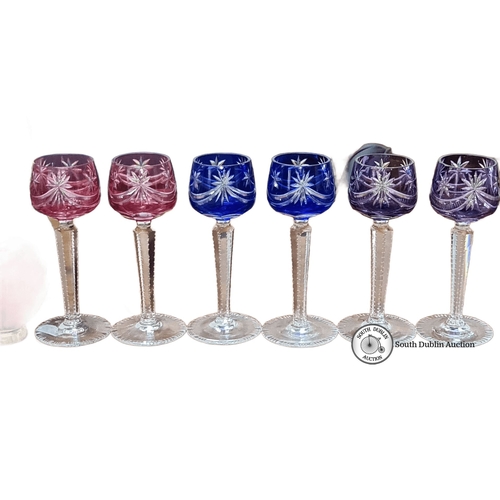 716 - Set of six cut crystal stemware glasses in rich pink and blue hues, featuring intricate starburst pa... 