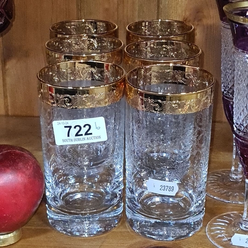 722 - Set of six heavy etched glass tumblers with ornate gold rims, featuring intricate scrolling patterns... 