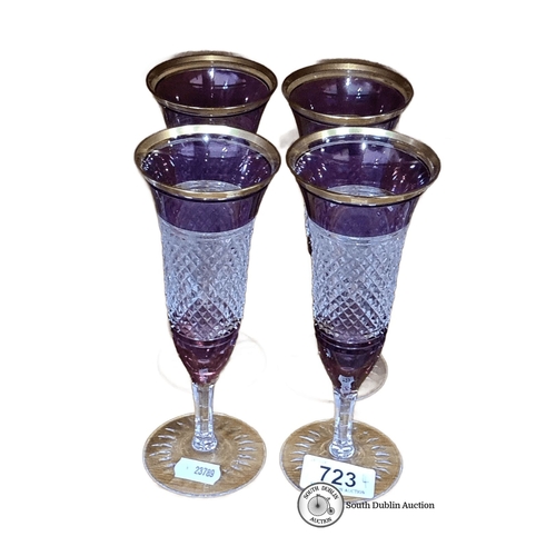 723 - Set of four amethyst and clear cut glass champagne flutes with gold rim detailing. heavy very good q... 