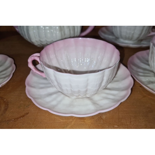 727 - Super Star Lot :A fabulous early Belleek shell-pattern porcelain tea set, featuring two teapot, six ... 