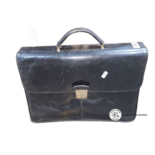 729 - Vintage leather briefcase with brass hardware, featuring multiple compartments for organization. Cla... 