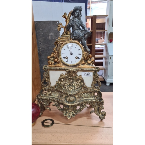 730 - Star Lot : A very large Antique French mantel clock with ormolu and marble details, featuring a seat... 