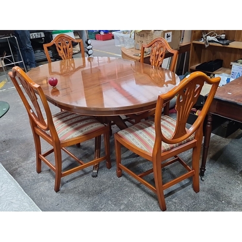 742 - Star lot : A handsome Mahogany dining table with four matching chairs features intricate chair back ... 