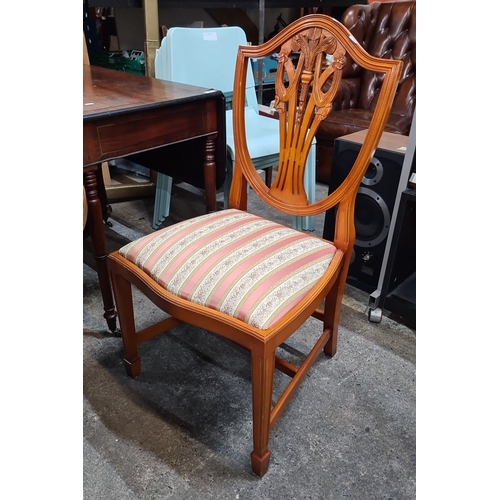 742 - Star lot : A handsome Mahogany dining table with four matching chairs features intricate chair back ... 