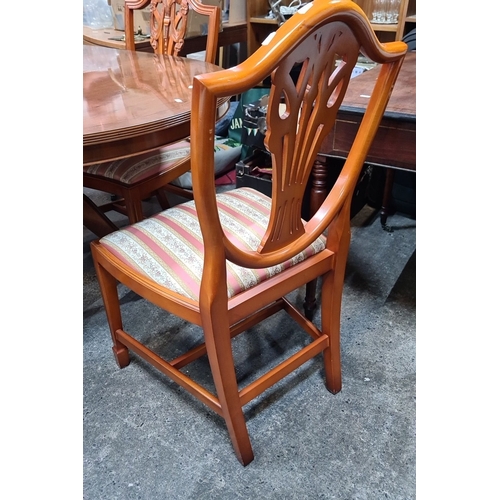 742 - Star lot : A handsome Mahogany dining table with four matching chairs features intricate chair back ... 