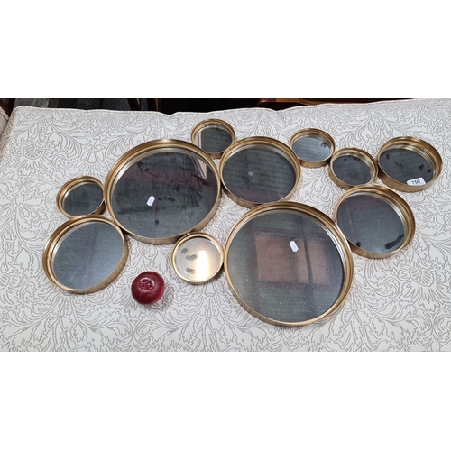 750 - Set of ten vintage brass-framed circular sieves of various sizes with mesh surfaces.