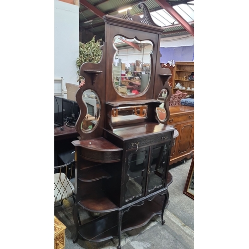 755 - Victorian mahogany sideboard with mirrored back, intricate detailing, and glass-front cabinets. Refl... 