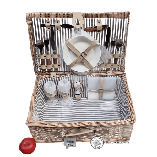 578 - Wicker picnic basket set with integrated cutlery, plates, and glasses in a striped interior. Feature... 