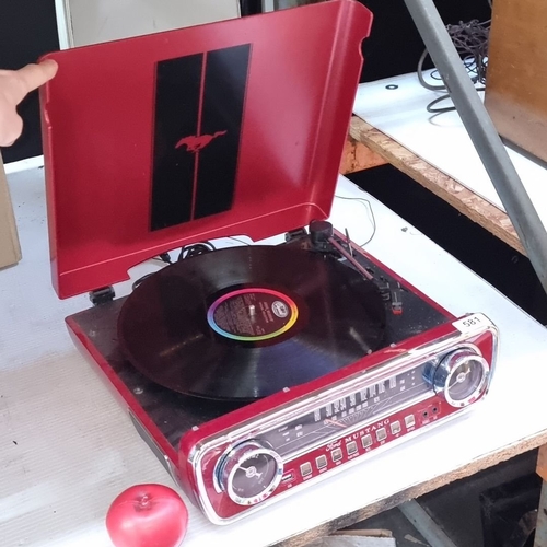 581 - A very cool  Ford Mustang stereo with radio and record player with the iconic Mustang logo.