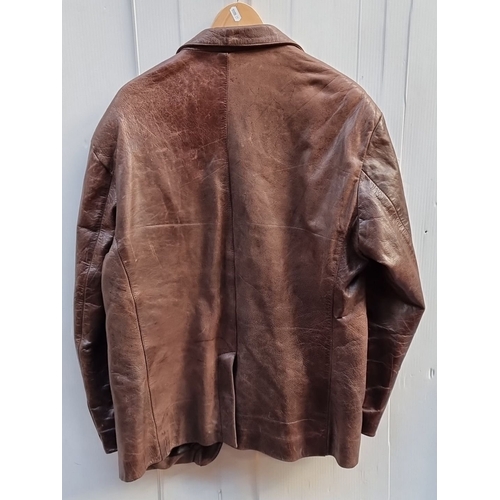 588 - Brown leather jacket by Nickelson, featuring button-down front and three pockets. 