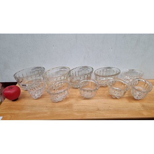 596 - Set of 8 Antique  British pressed glass jelly molds, featuring fluted designs, marked 