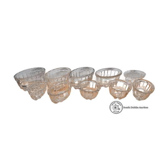 596 - Set of 8 Antique  British pressed glass jelly molds, featuring fluted designs, marked 