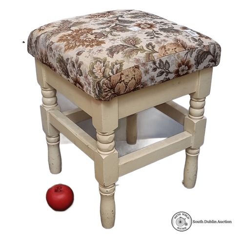 599 - Vintage upholstered stool featuring ornate floral tapestry seat and cream painted wooden legs.