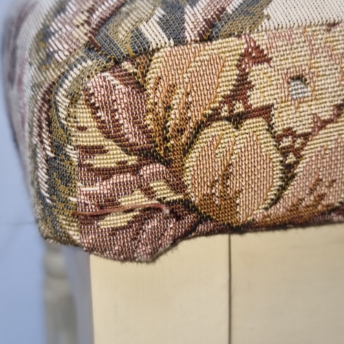 599 - Vintage upholstered stool featuring ornate floral tapestry seat and cream painted wooden legs.