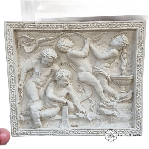 600 - Plaster relief depicts cherubs in classical style, framed with an intricate border. Dimensions and m... 