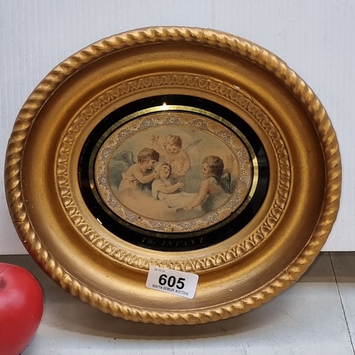 605 - Round gilded wooden frame with vintage angelic image, titled 