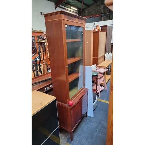 611 - Star Lot : A handsome : Red Mahogany display cabinet with single glass door and interior shelves and... 