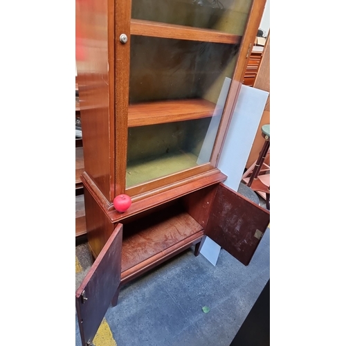 611 - Star Lot : A handsome : Red Mahogany display cabinet with single glass door and interior shelves and... 