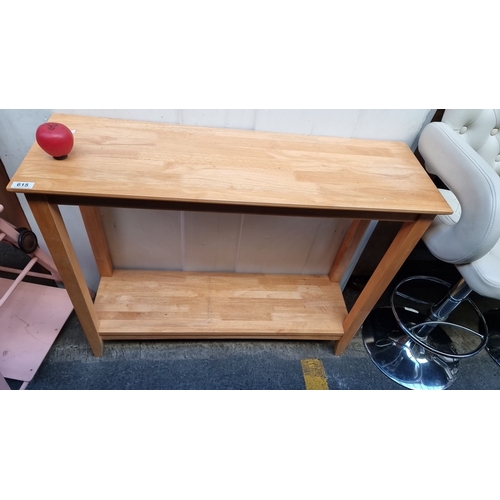 615 - Two-tier console table in light oak, showcasing a simple yet elegant design.