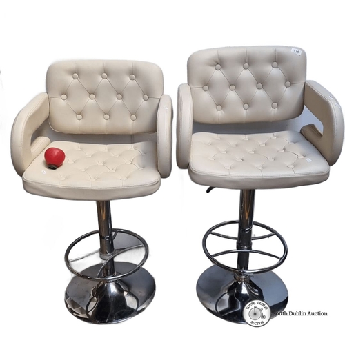 616 - Pair of contemporary tall bar stools with tufted cream upholstery and chrome swivel bases. Modern de... 