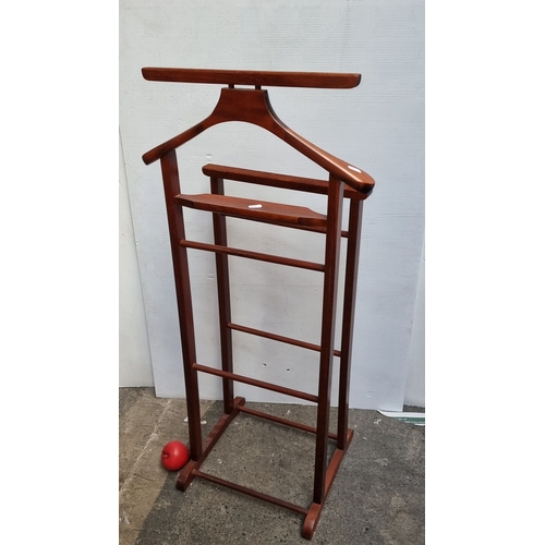 617 - Mahogany valet stand, mid-century modern style, features a hanger and tiered racks.