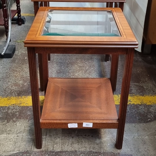 624 - Set of three nesting tables with glass tops and mahogany frames, featuring a classic Mid-Century Mod... 