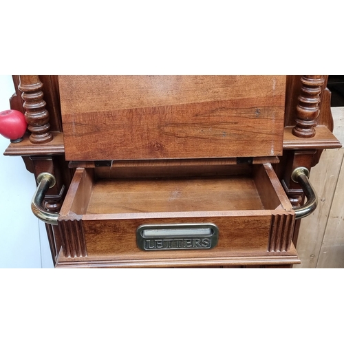 625 - Star Lot An Edwardian mahogany hall stand with mirror and integrated hooks, features intricate turne... 