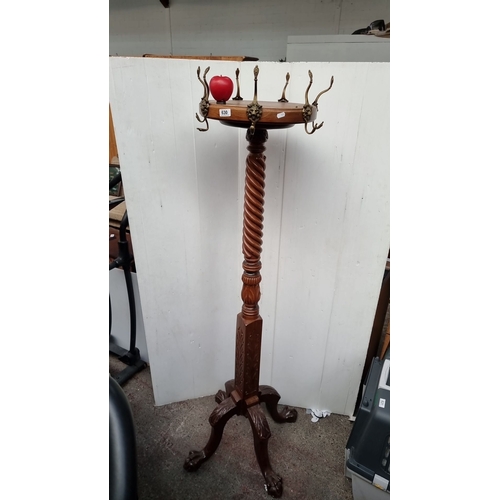 630 - Star Lot : Victorian-style mahogany hat stand features an intricately carved twisted column and bron... 