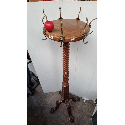 630 - Star Lot : Victorian-style mahogany hat stand features an intricately carved twisted column and bron... 