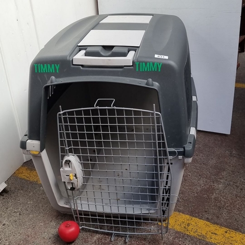 631 - A large Plastic pet crate with attachment latches, features a gray and white design labeled . Includ... 