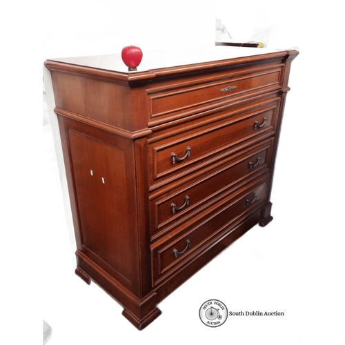 632 - A handsome red Mahogany chest of drawers with brass handles and detailed carvings.