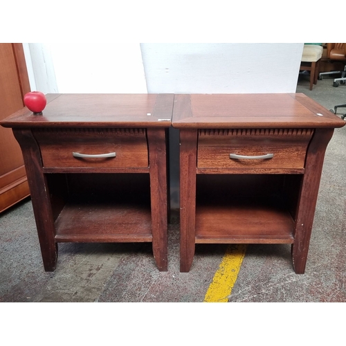 633 - Pair of mahogany side tables with single drawer and open shelf, featuring contemporary metal handles... 