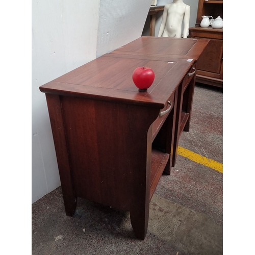 633 - Pair of mahogany side tables with single drawer and open shelf, featuring contemporary metal handles... 