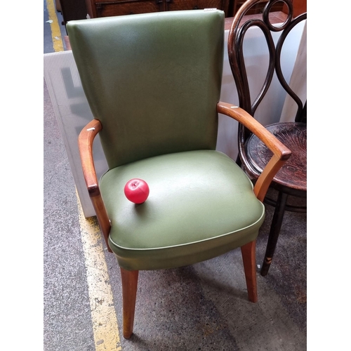 634 - A very handsome Mid-Century Modern green upholstered chair with curved wooden arms and legs. In good... 