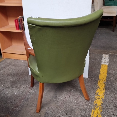 634 - A very handsome Mid-Century Modern green upholstered chair with curved wooden arms and legs. In good... 