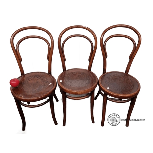 636 - Set of three vintage bentwood chairs with intricately carved seat designs, showcasing classic Thonet... 