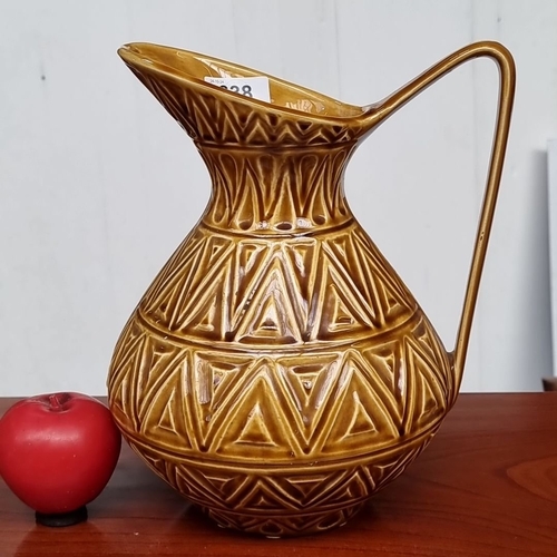 638 - Earthenware jug with geometric pattern, made in the Republic of Ireland.