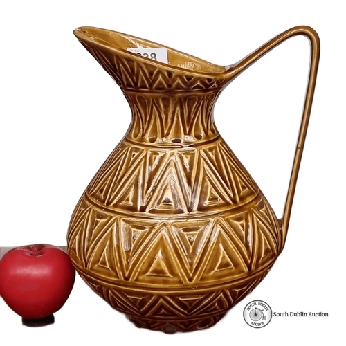 638 - Earthenware jug with geometric pattern, made in the Republic of Ireland.