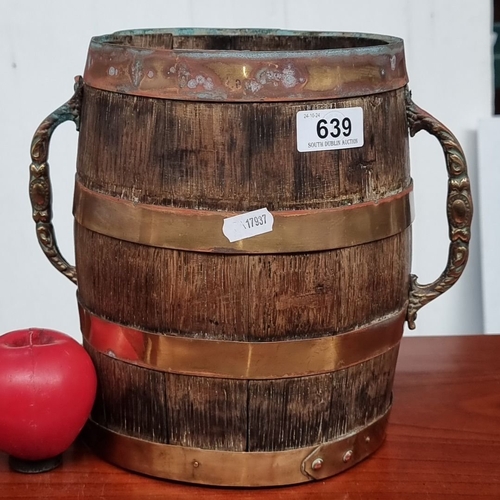 639 - Antique oak barrel with brass bands and ornate handles. From the early 20th century. Possibly an app... 