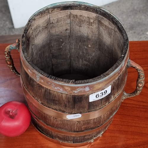 639 - Antique oak barrel with brass bands and ornate handles. From the early 20th century. Possibly an app... 