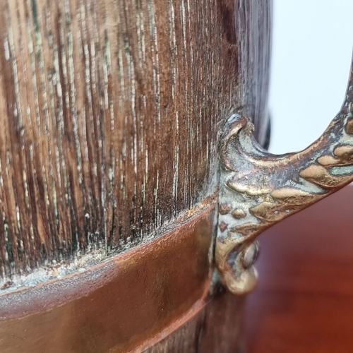 639 - Antique oak barrel with brass bands and ornate handles. From the early 20th century. Possibly an app... 