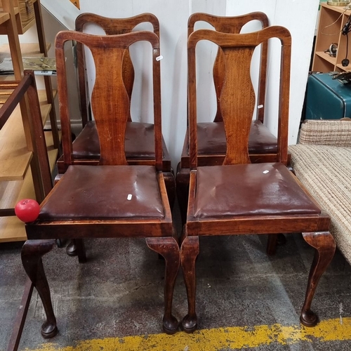 647 - Set of four antique wooden dining chairs with leather seats, featuring elegant cabriole legs. From t... 