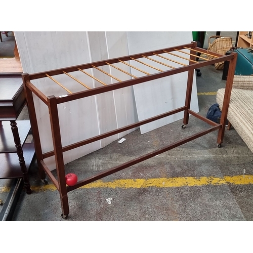 648 - Star Lot : A Fabulous mid century teak  clothes drying rack with slatted design and caster wheels, f... 