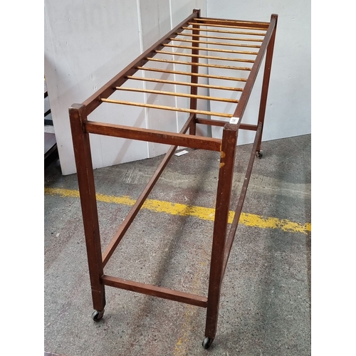 648 - Star Lot : A Fabulous mid century teak  clothes drying rack with slatted design and caster wheels, f... 