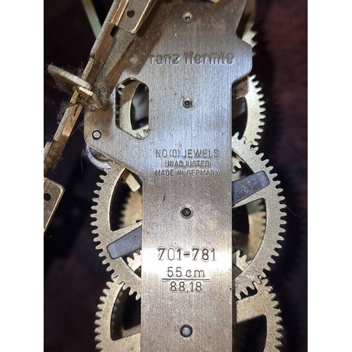 656 - Franz Hermle brass clock mechanism, made in Germany, features visible gears. Includes brass handle m... 