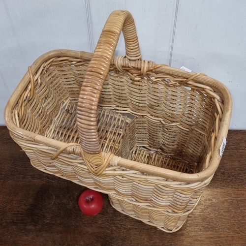 666 - Natural woven basket with rustic charm of this two-tiered wicker basket with a sturdy handle for a s... 