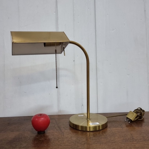 667 - Brass banker-style desk lamp with pull chain, featuring an angular shade. Electric plug included.