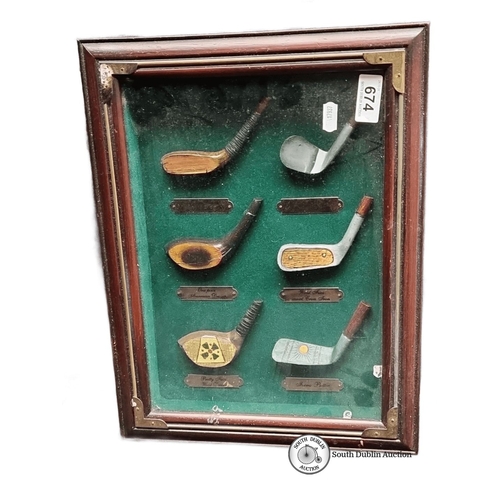 674 - Framed set of vintage style golf club heads displayed on green felt. Features labels identifying dif... 